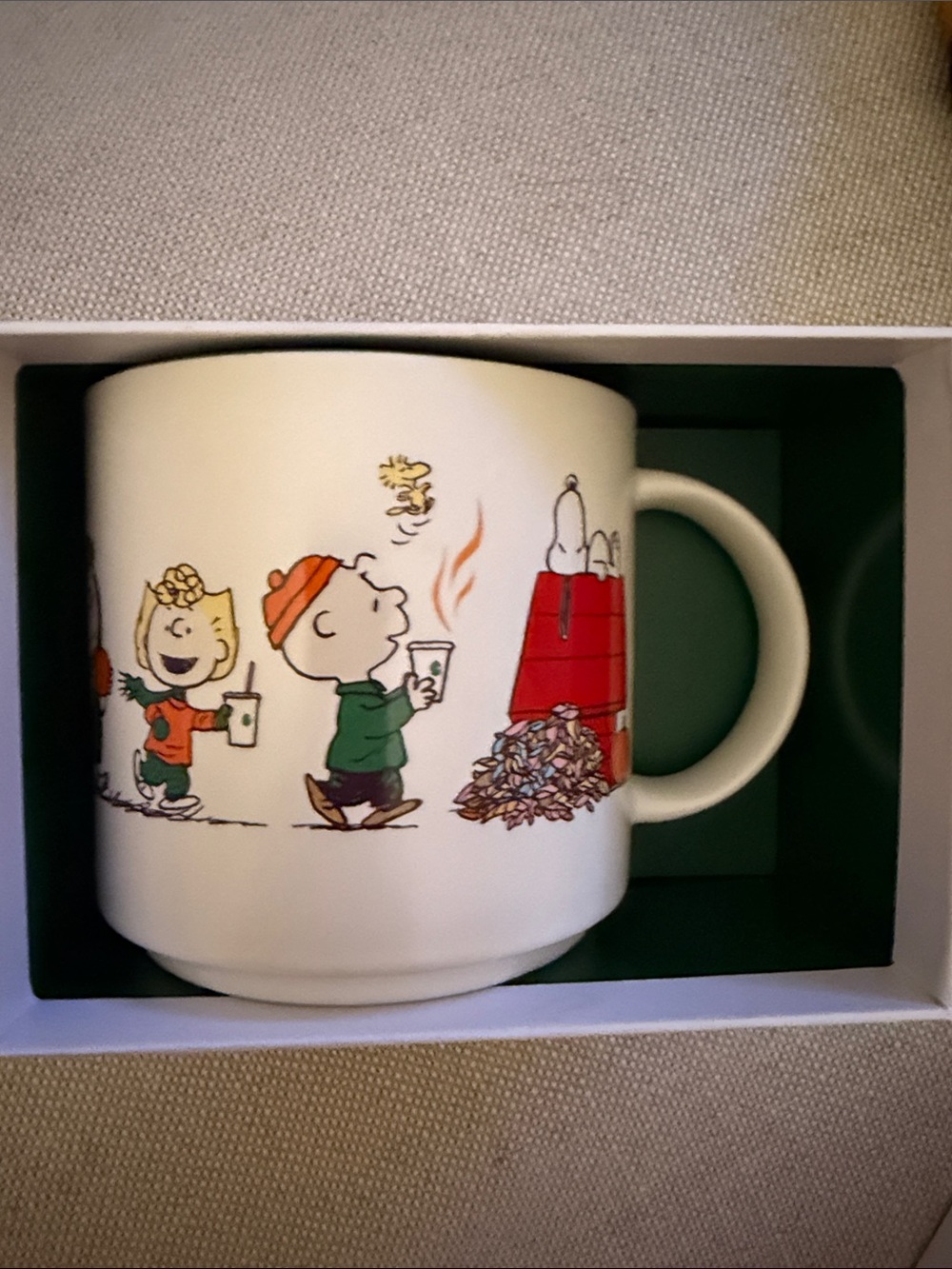 Starbucks White Ceramic Mug with Red, Green and Orange Peanuts Characters